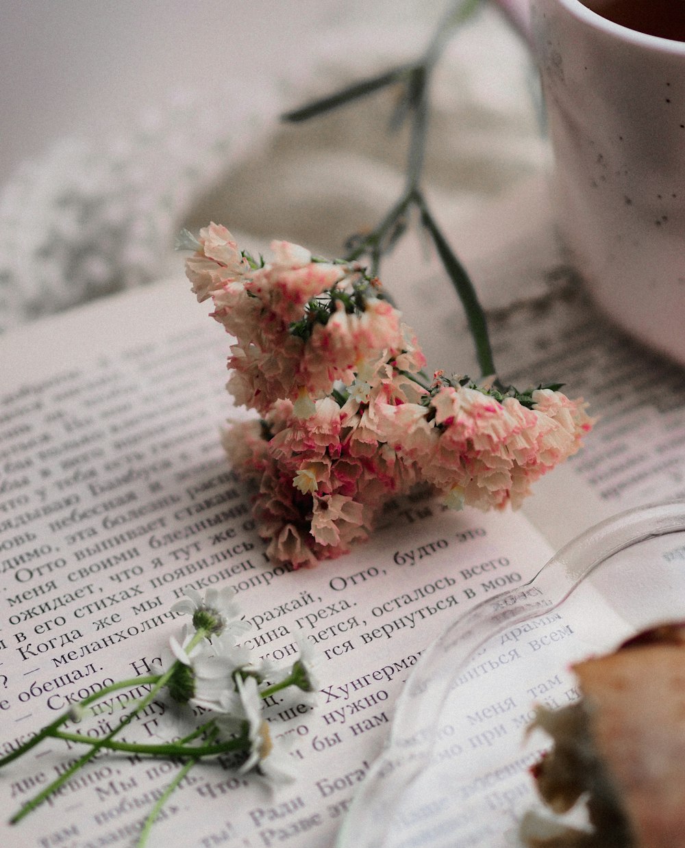 pink and white flower bouquet on book page