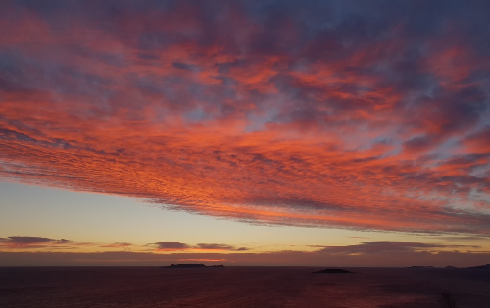 orange and blue cloudy sky during sunset