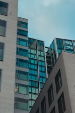 gray concrete building under white clouds during daytime