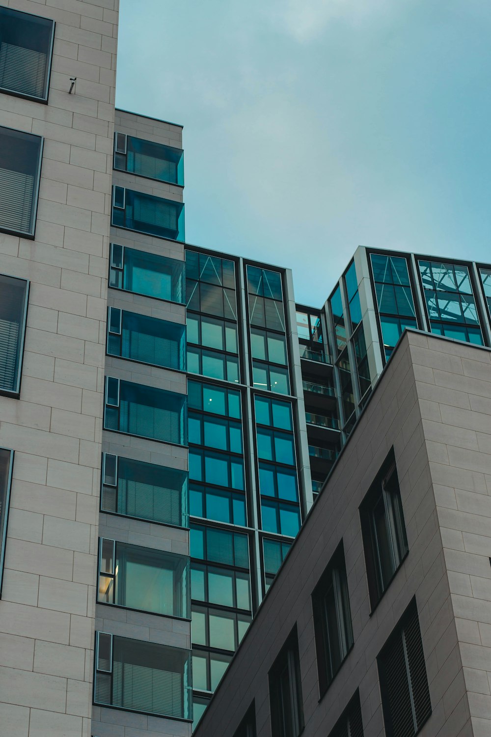 gray concrete building under white clouds during daytime