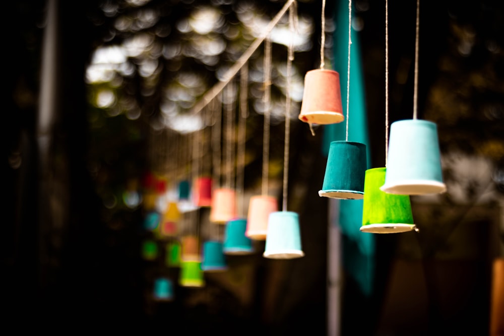 selective focus photography of hanging light bulbs