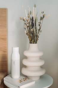 white ceramic vase with flowers