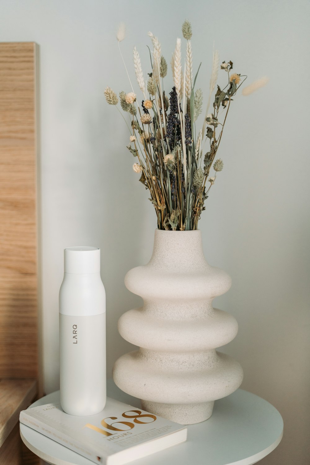 white ceramic vase with flowers