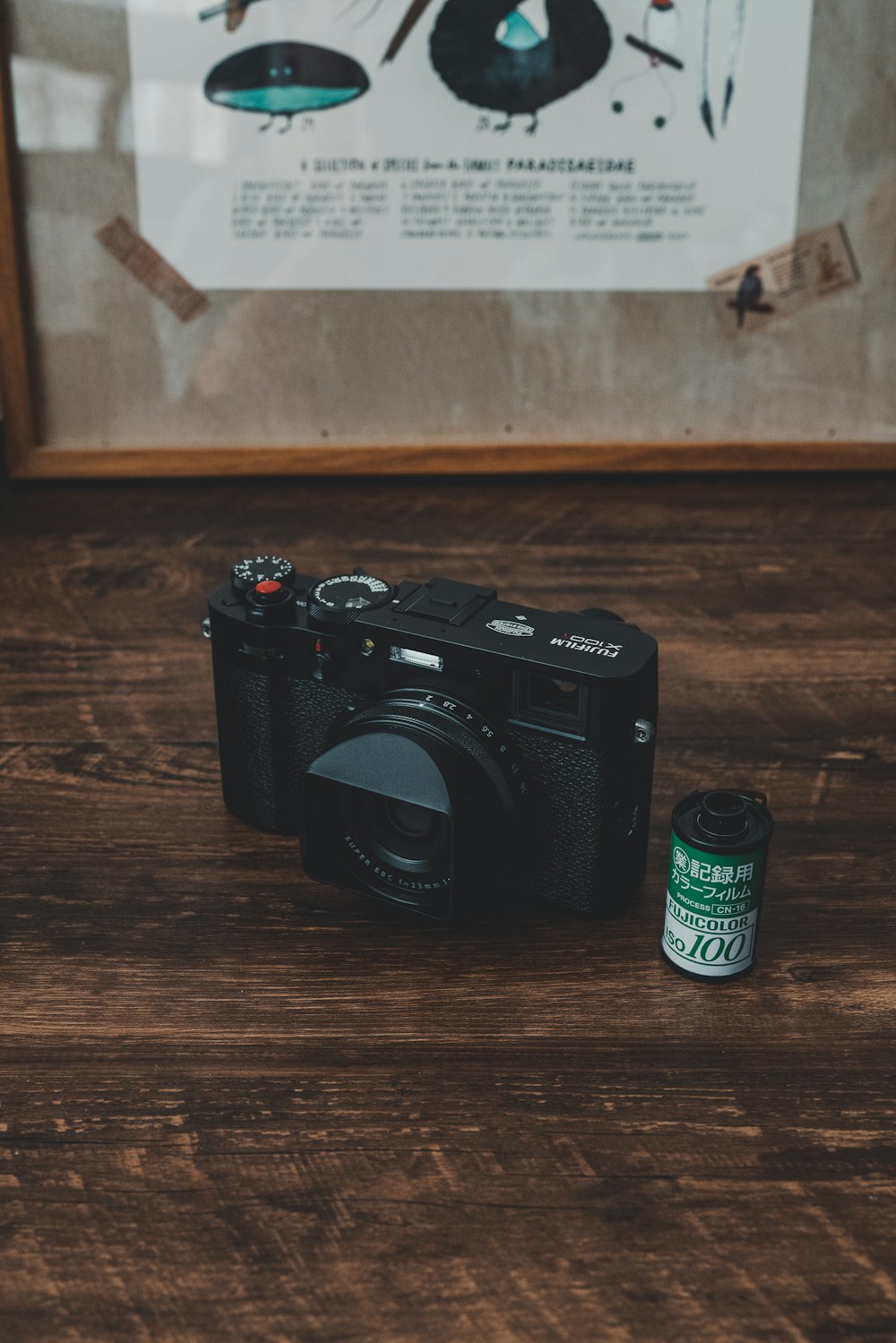 black nikon dslr camera on brown wooden table