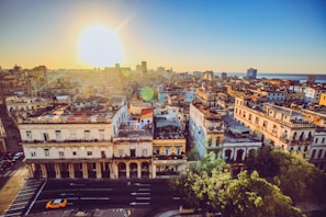 A panoramic view of Xanxerê's cityscape at sunset with warm light illuminating the buildings and streets.