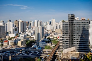 city skyline under blue sky during daytime