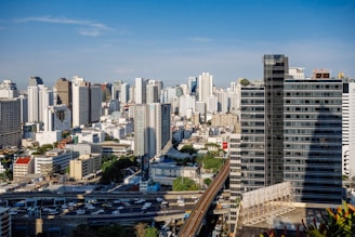 city skyline under blue sky during daytime