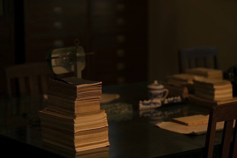 brown and black books on black table