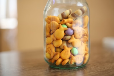 A variety of fish crackers displayed in a bowl.