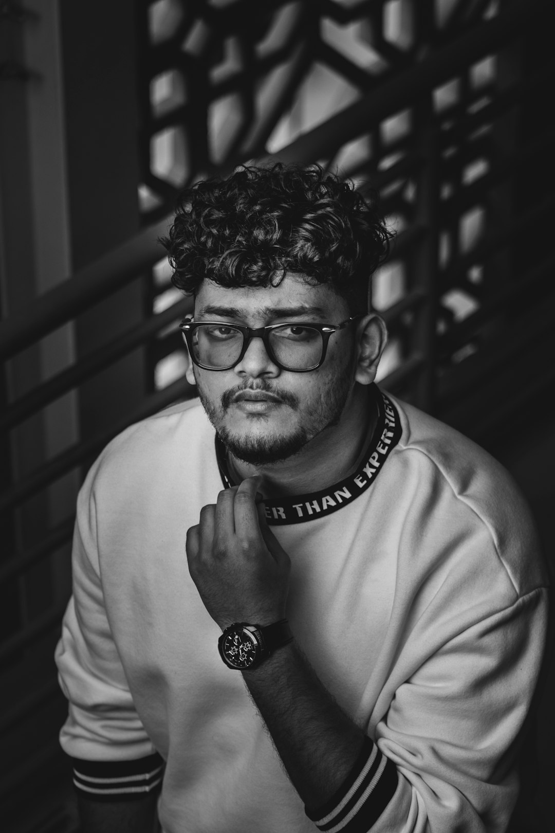 man in white crew neck shirt wearing black framed eyeglasses