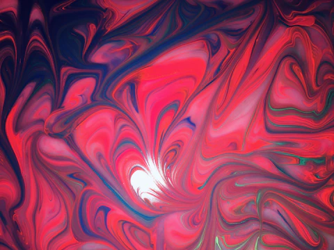 A vibrant swirl of pink and red hues blending like a living flame, symbolizing authentic self-expression.