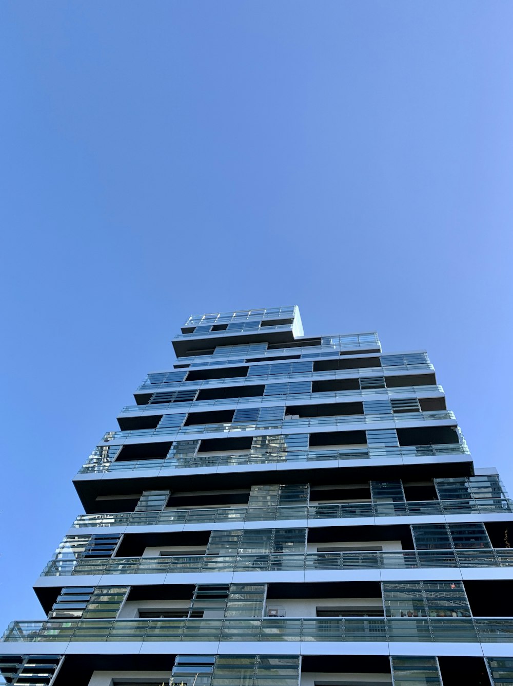 white concrete building under blue sky during daytime