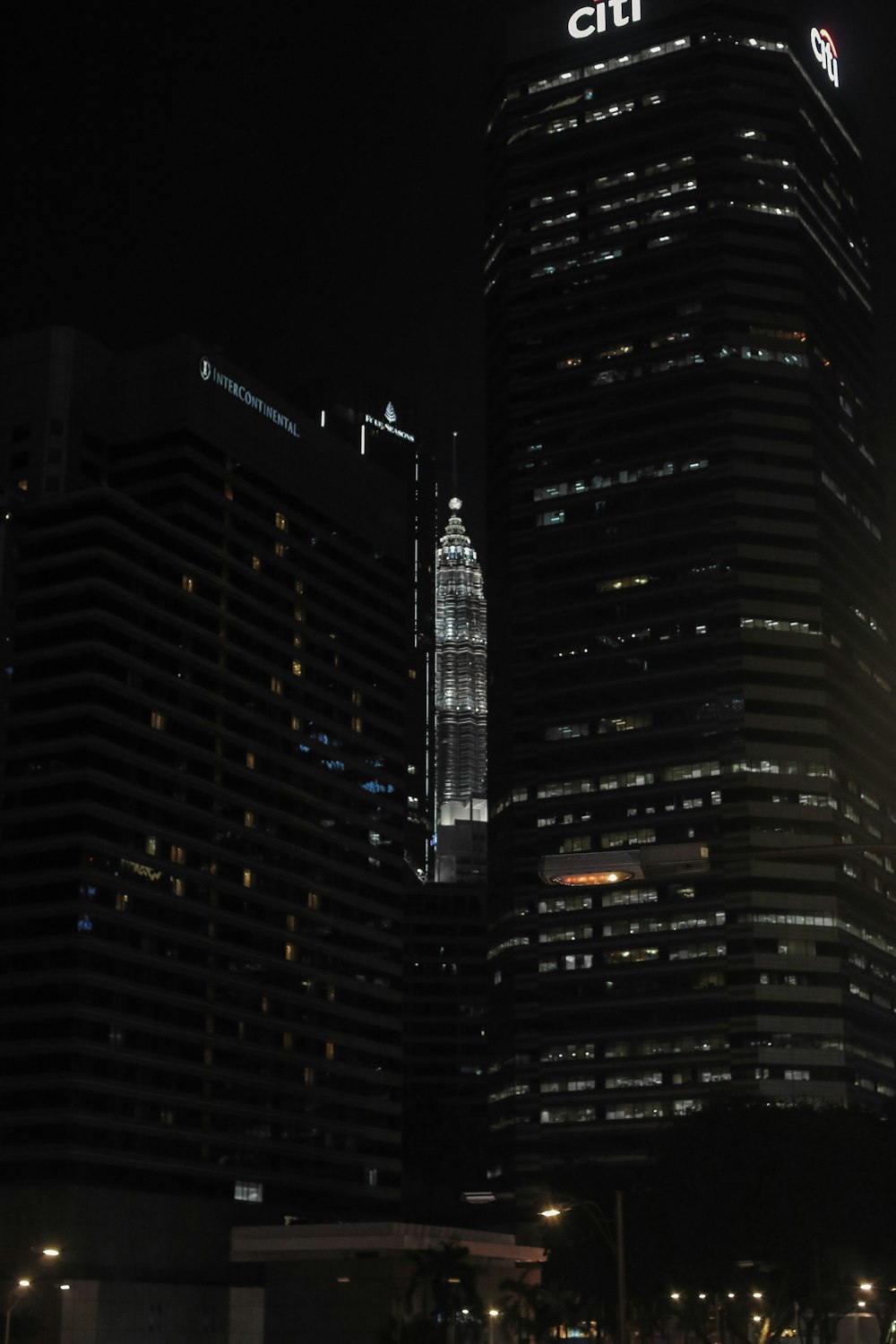 black and yellow high rise building during night time