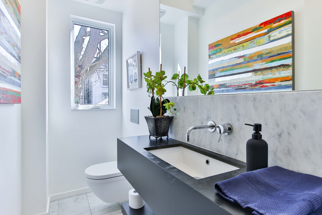 white ceramic sink with stainless steel faucet