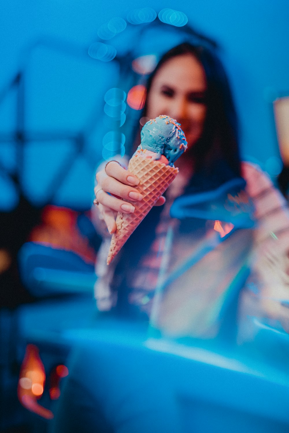 person holding ice cream cone