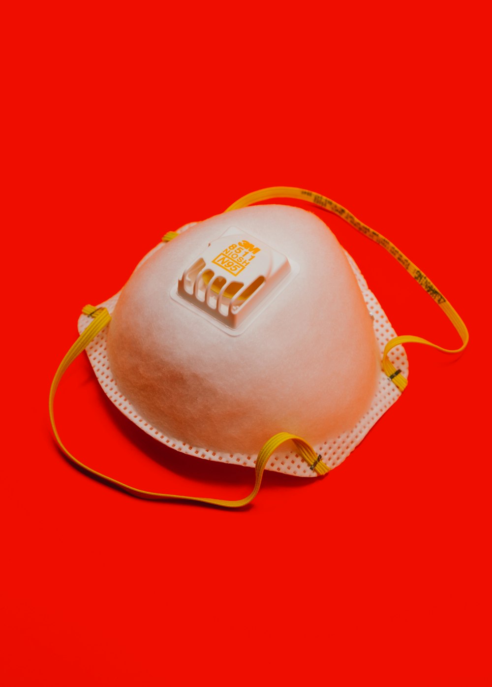 white and yellow leather sling bag