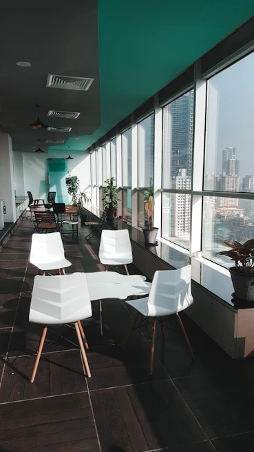 Bright meeting room featuring high-end furniture and large windows overlooking Campo de las Naciones