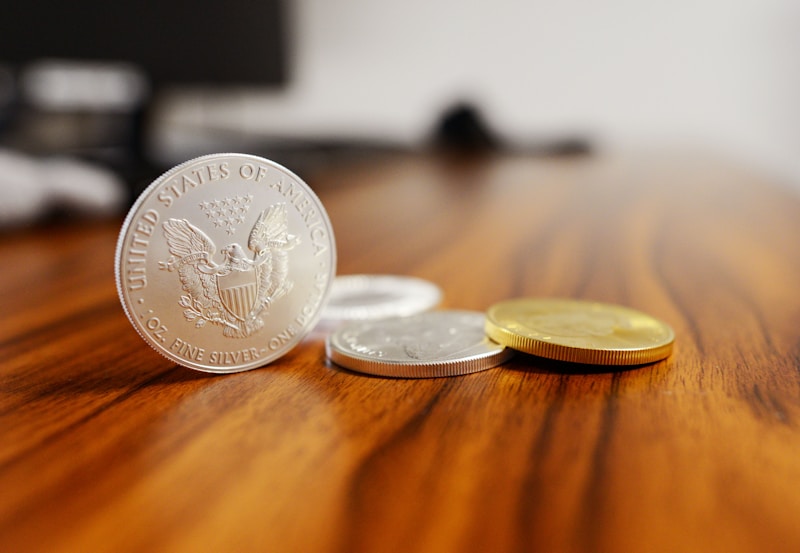 Silver coins on a wooden table