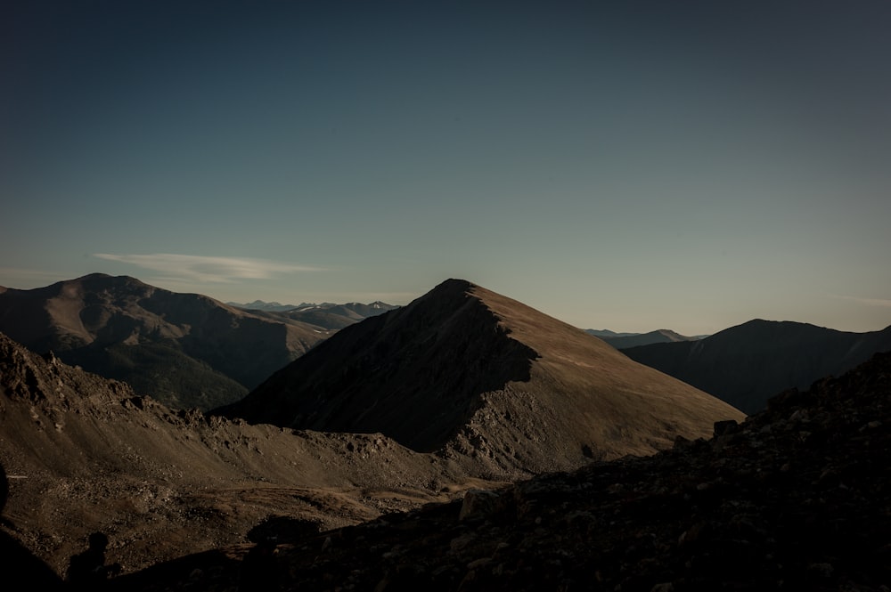 brown mountain under blue sky during daytime