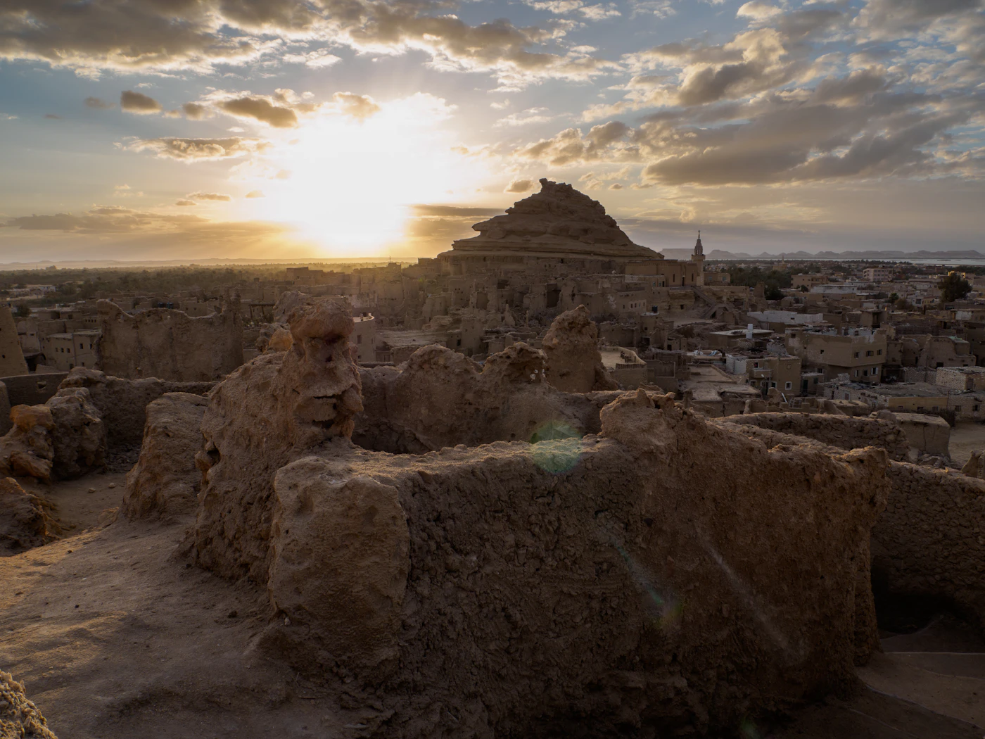 Shali fortress ruins at sunrise above the town of Siwa