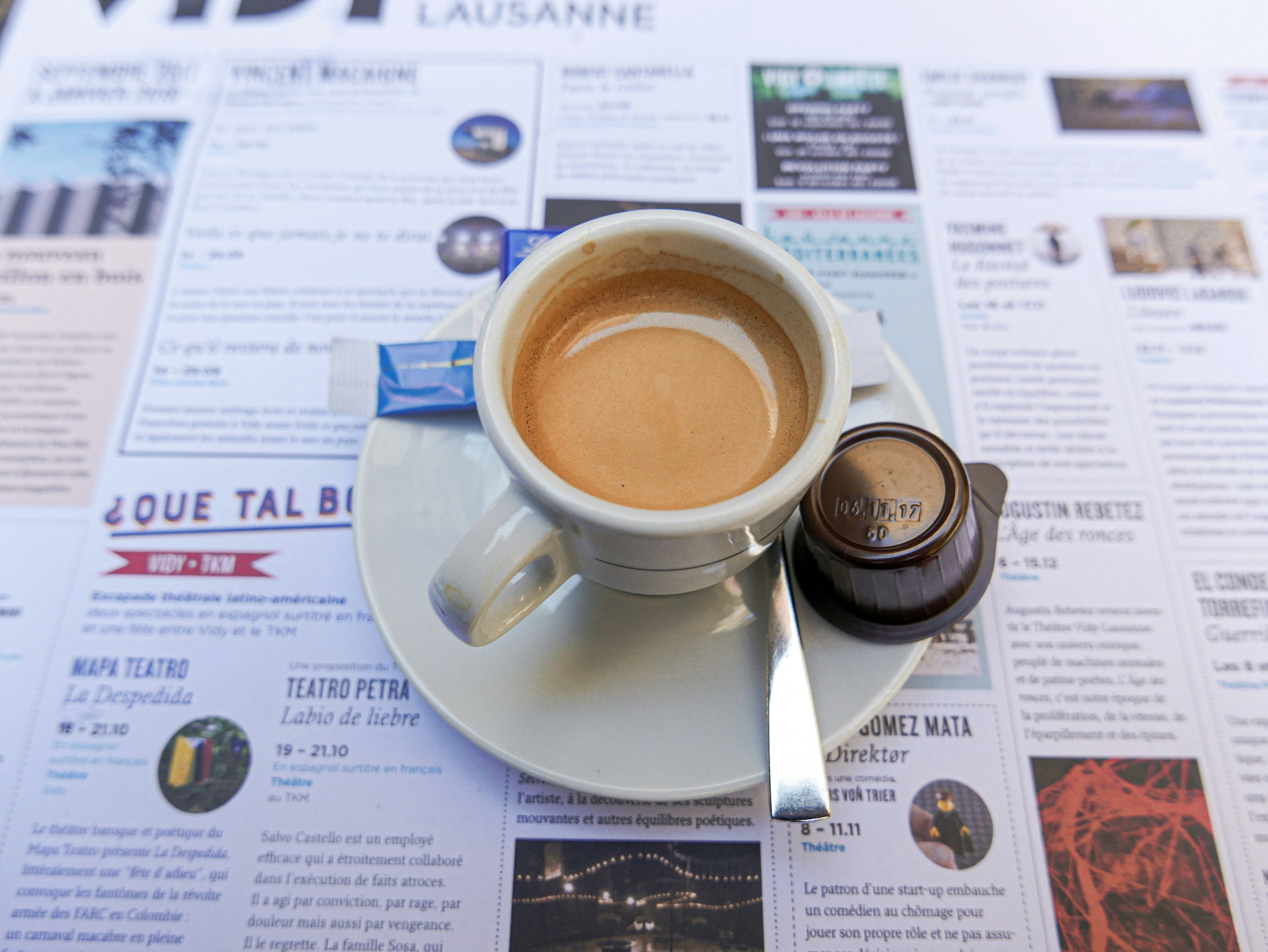 white ceramic mug on white paper