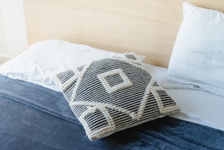 white and gray throw pillow