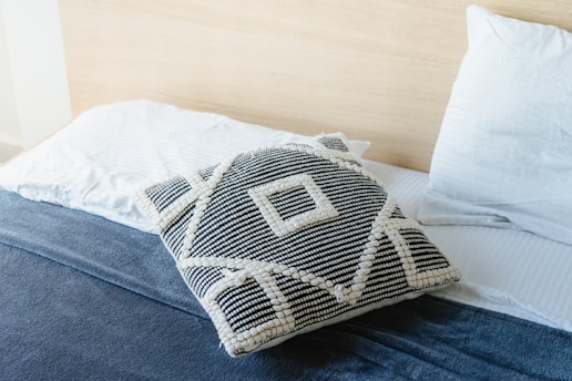 white and gray throw pillow