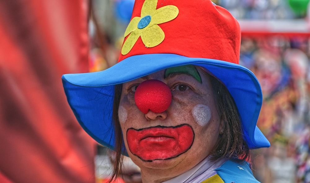 girl in white shirt with blue and red floral mask