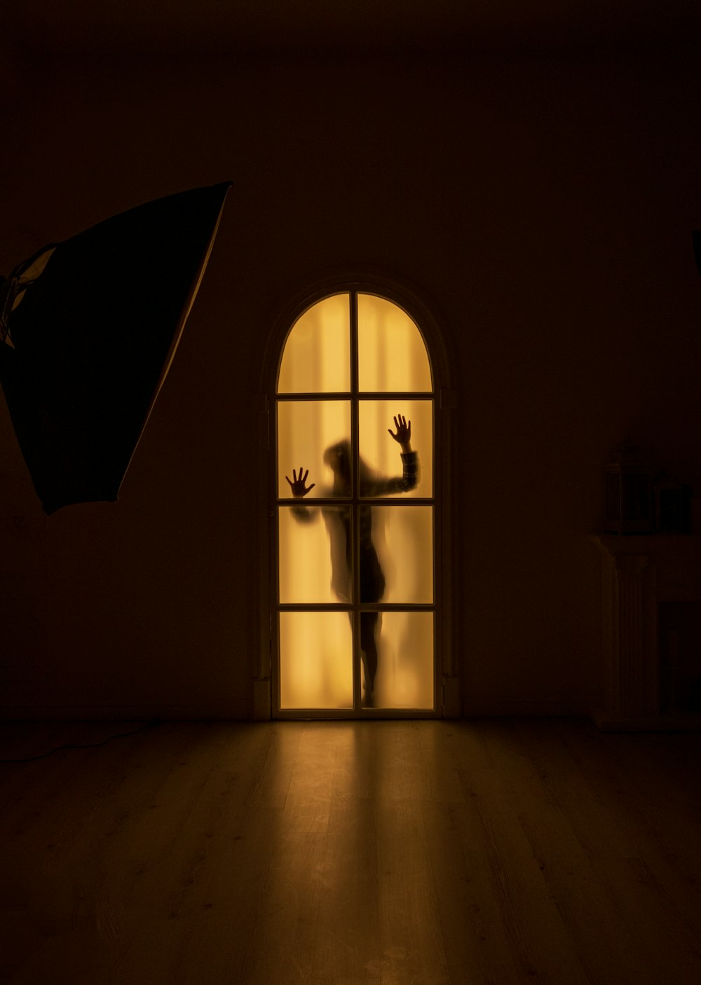 black umbrella on window during daytime