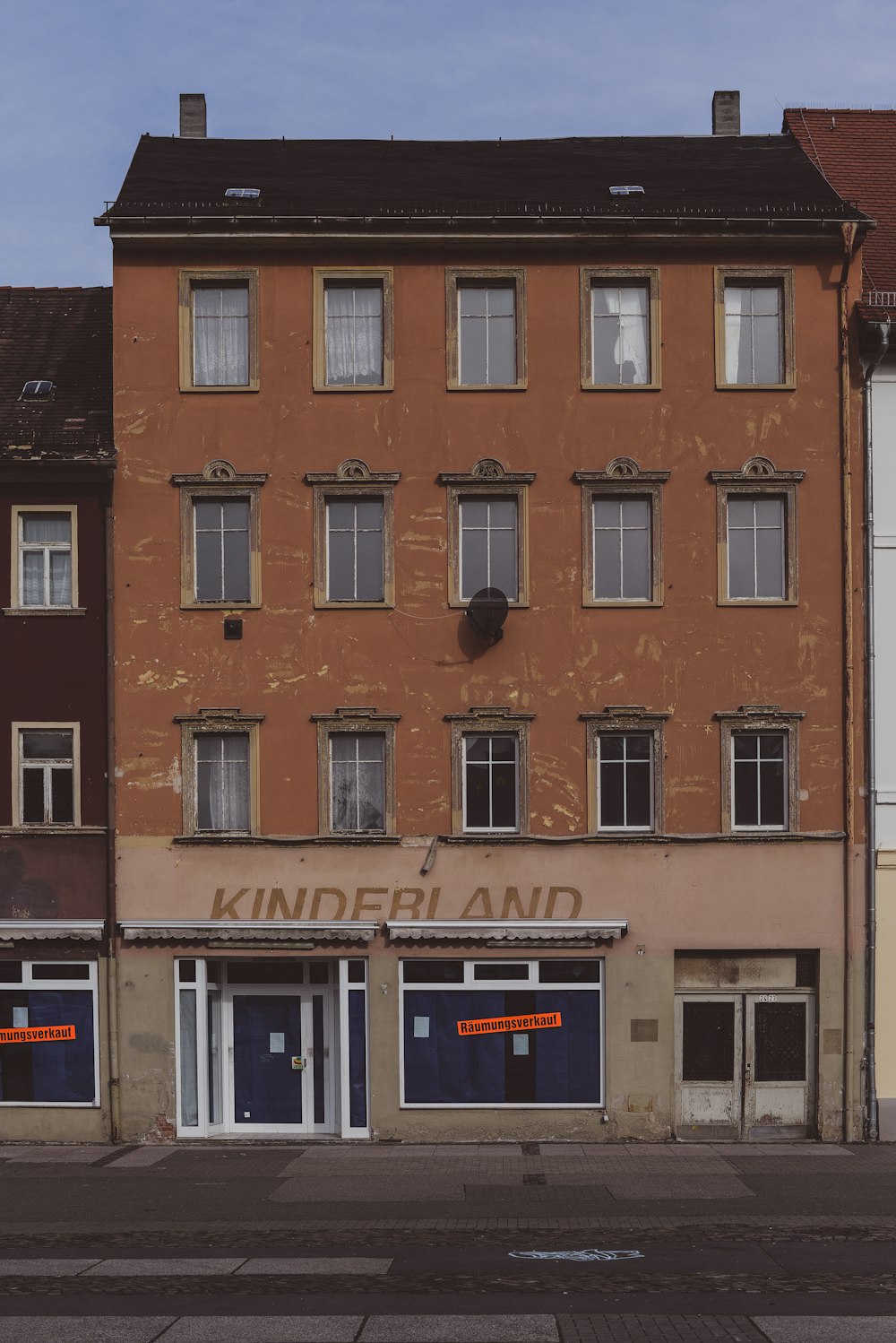 brown and white concrete building during daytime