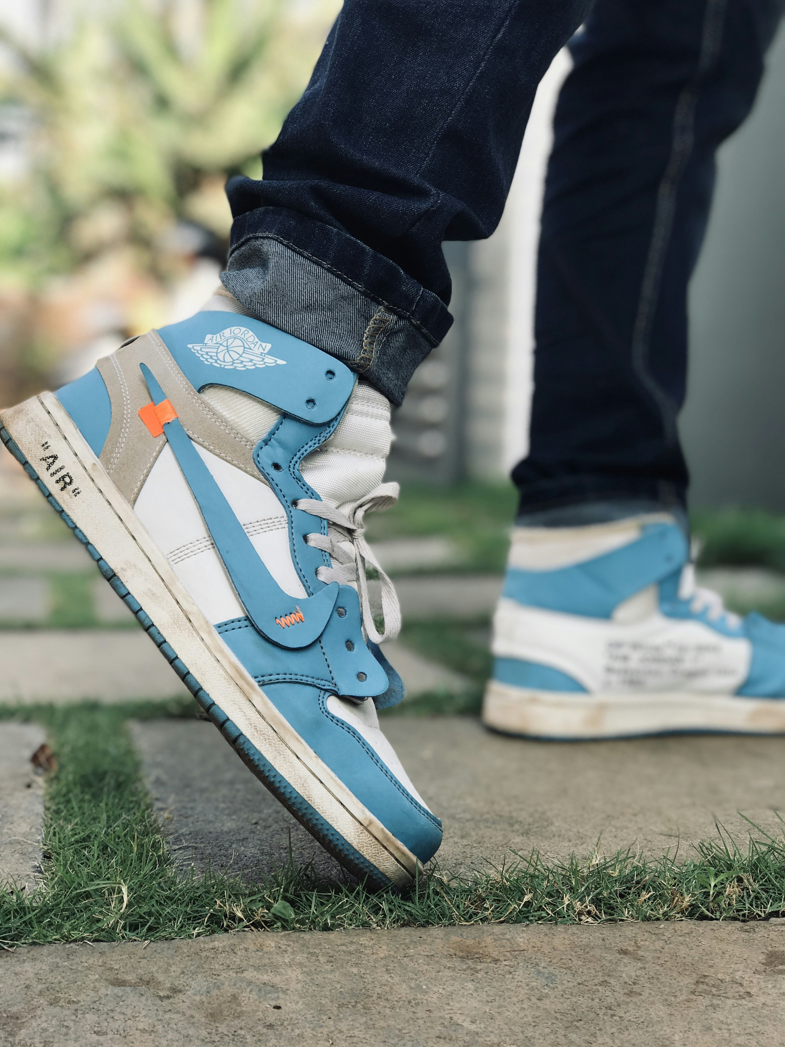 Person In Blue And White Nike Air Jordan 1 Shoes Photo Free Clothing Image On Unsplash