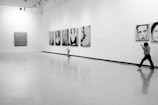 grayscale photo of people in a room