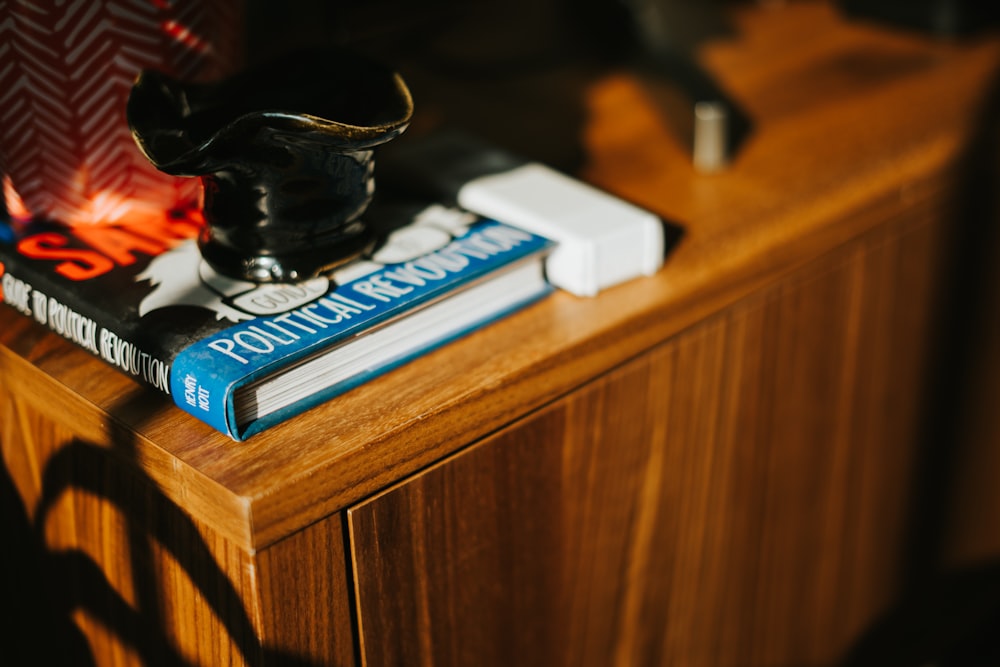 black remote control on brown wooden table