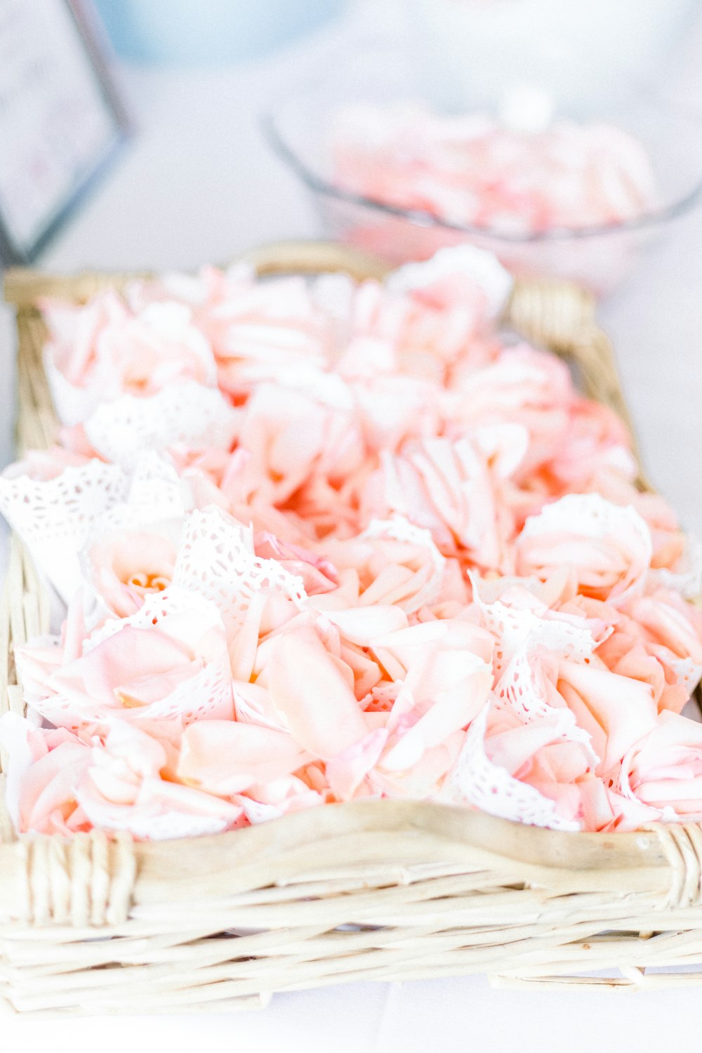 pink and white flower petals on clear glass bowl