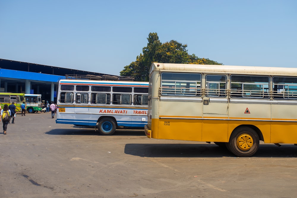yellow and blue bus on road during daytime