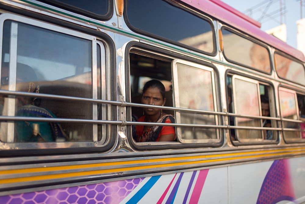 woman in red shirt inside train