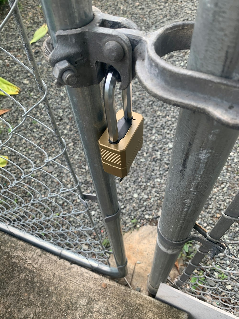 a padlock attached to a metal gate