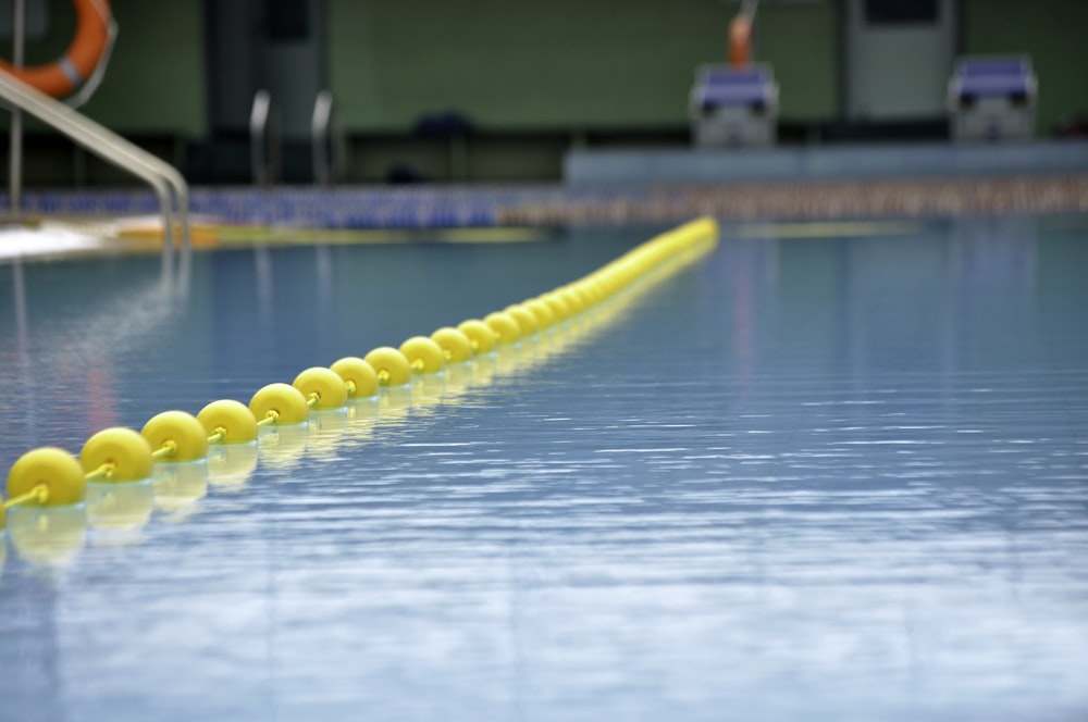 yellow inflatable ring on swimming pool