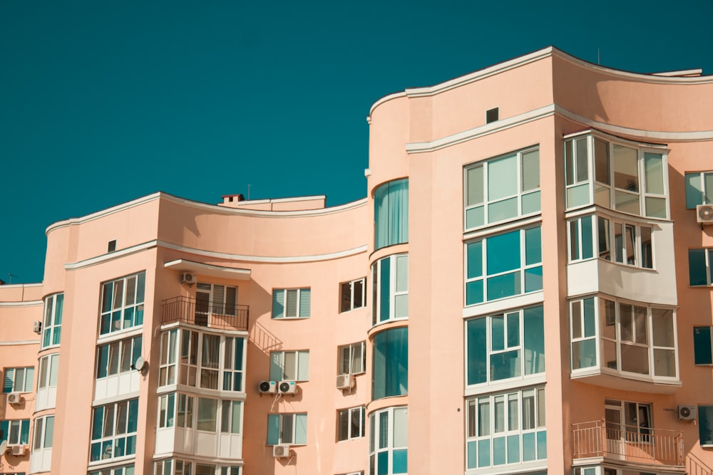 brown concrete building under blue sky during daytime