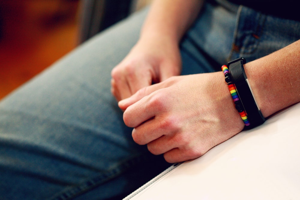 person wearing black smart watch