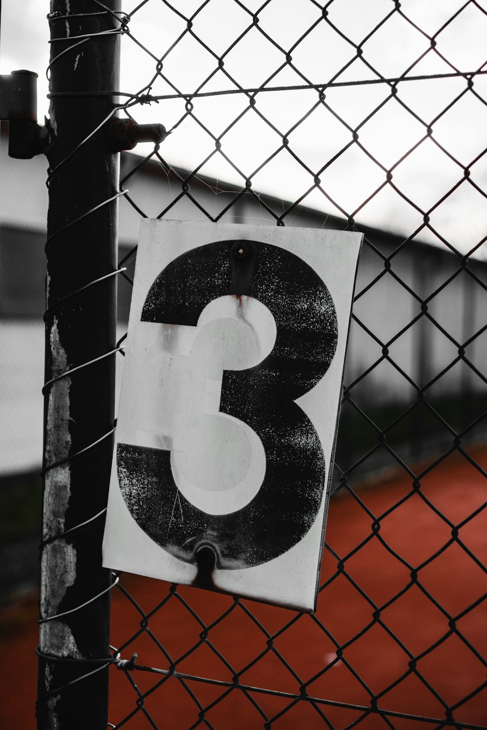 black and white number 9 on gray metal fence