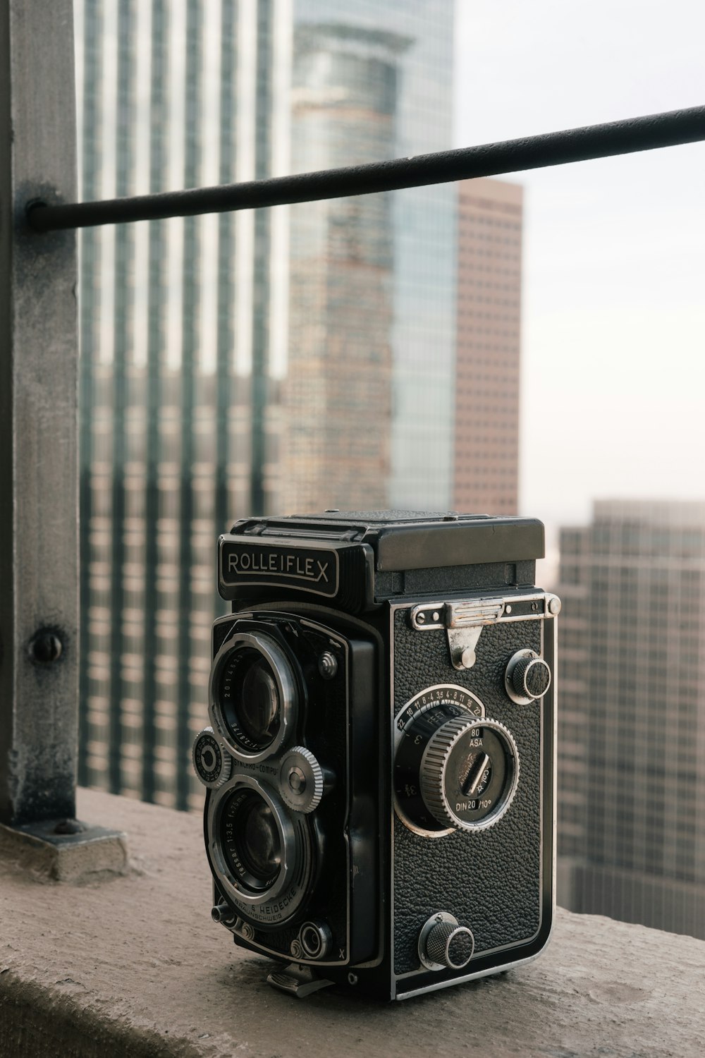 black and silver camera on brown wooden table