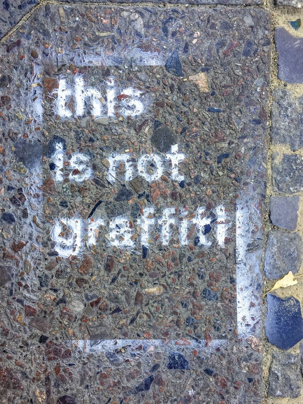 brown brick wall with i am a little girl text