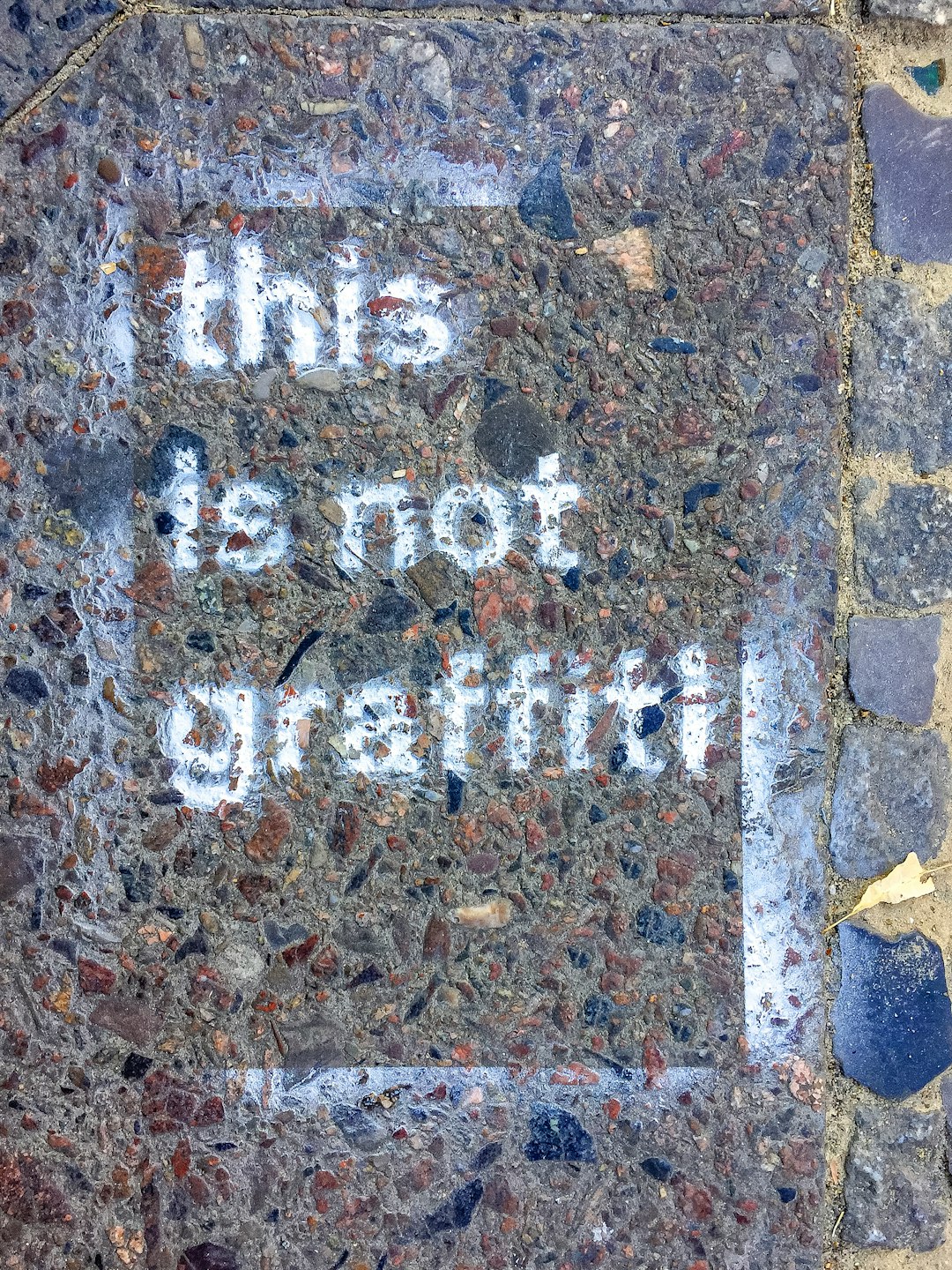 brown brick wall with i am a little girl text