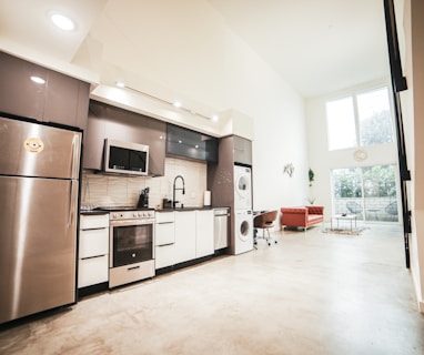 brown wooden kitchen cabinet near white wall