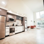 brown wooden kitchen cabinet near white wall