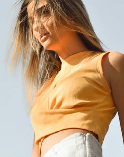 woman in yellow sleeveless shirt
