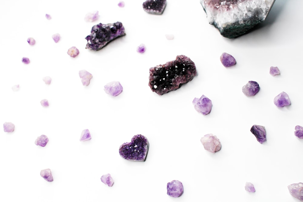 purple and white stones on white surface