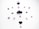 Several purple crystals and stones are arranged in a circular pattern on a white background. The stones vary in shape and size, with two heart-shaped crystal clusters positioned at the top and bottom.