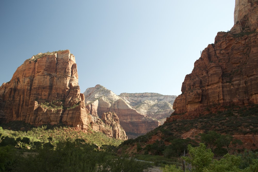 brown rocky mountain under blue sky during daytime